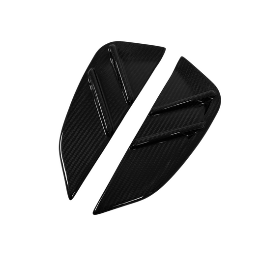 Two black carbon fiber winglets on a white background