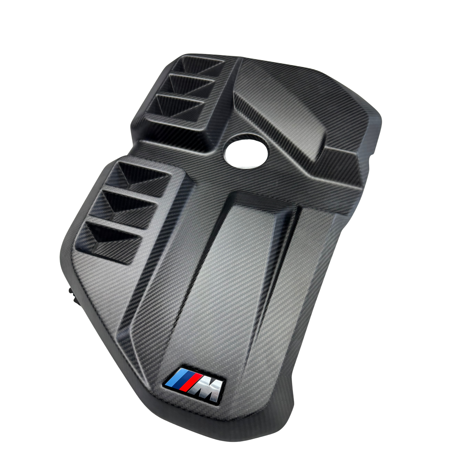 Carbon fiber-patterned car part with BMW M logo on a white background