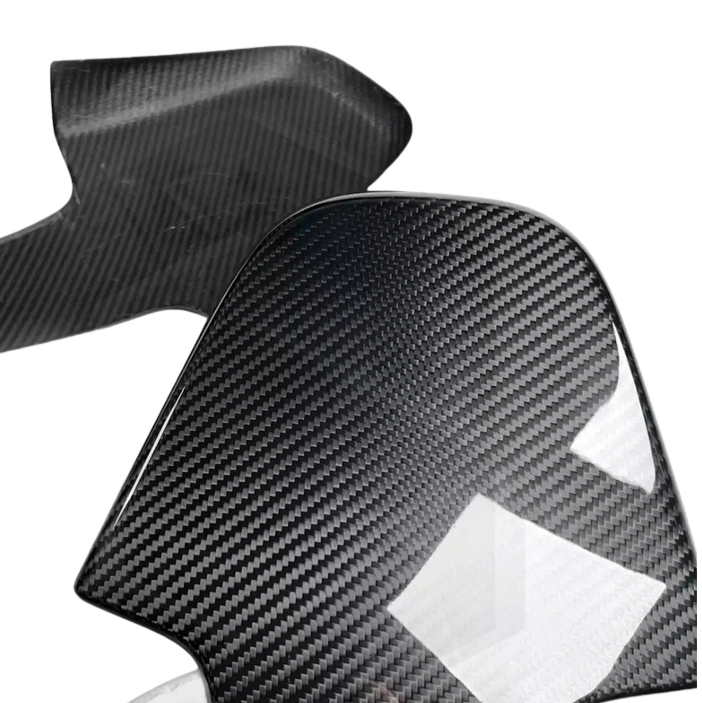 Two black carbon fiber headrest backs