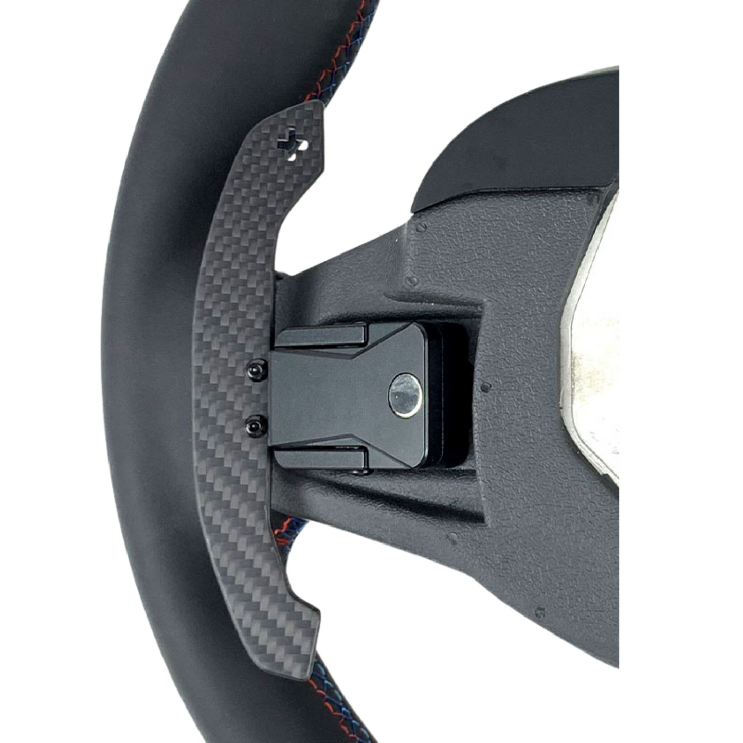 Close-up of a steering wheel with carbon fiber texture on a white background